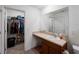 Bathroom featuring a single sink vanity with storage and closet at 2355 Allsup Ter, North Port, FL 34286