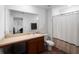 Bathroom with a single sink vanity, toilet, and shower/tub combo at 2355 Allsup Ter, North Port, FL 34286