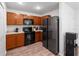 Well-equipped kitchen showcasing modern appliances, wood cabinets, and ample countertop space at 2355 Allsup Ter, North Port, FL 34286