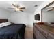 This main bedroom has wood-look flooring, ceiling fan and lots of light at 2355 Allsup Ter, North Port, FL 34286