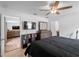 The bedroom features wood flooring, a ceiling fan, a dresser, and a TV at 2355 Allsup Ter, North Port, FL 34286