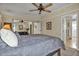 Bright bedroom featuring a closet with mirrored doors and ensuite bath at 239 Cutter Ct, North Port, FL 34287
