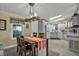 Open dining area with easy access to the kitchen, featuring modern lighting at 239 Cutter Ct, North Port, FL 34287