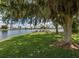 Scenic lakeside area with picnic tables offering a serene escape at 239 Cutter Ct, North Port, FL 34287