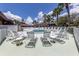 Relaxing pool area with hot tub and lots of lounge chair seating at 239 Cutter Ct, North Port, FL 34287