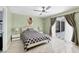 Bedroom featuring a slider to the pool area, en-suite bathroom, and neutral walls at 2445 Apache St, Sarasota, FL 34231