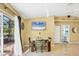 Bright dining room with sliding glass doors to the patio and a view of the backyard at 2445 Apache St, Sarasota, FL 34231