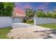 Charming single-story home featuring a manicured front yard and a private fenced entrance for added security at 2445 Apache St, Sarasota, FL 34231