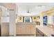 Open kitchen with breakfast bar that connects to the rest of the home at 2445 Apache St, Sarasota, FL 34231