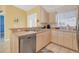 Bright kitchen features modern appliances, ample counter space, and plenty of natural light at 2445 Apache St, Sarasota, FL 34231