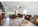 Bright living room with tile flooring, archway, and sliding glass doors to the lanai at 24536 Buckingham Way, Port Charlotte, FL 33980