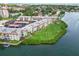 Aerial view of condo community on the water, featuring well-kept grounds and water access at 250 Santa Maria St # 314, Venice, FL 34285