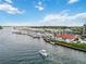 Boat cruising on the water near condos and marina with scenic views at 250 Santa Maria St # 314, Venice, FL 34285