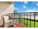 Balcony featuring a chair, table and railing with a view of the intercoastal waterway at 250 Santa Maria St # 314, Venice, FL 34285