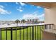 Balcony with scenic view of the intercoastal waterway, nearby buildings, and palm trees at 250 Santa Maria St # 314, Venice, FL 34285