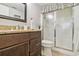 Bathroom featuring a granite countertop vanity and a walk-in shower with a decorative curtain rod at 250 Santa Maria St # 314, Venice, FL 34285
