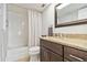 Bathroom with shower and granite countertop sink at 250 Santa Maria St # 314, Venice, FL 34285