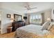 This bedroom has a dresser, a ceiling fan, and a window view at 250 Santa Maria St # 314, Venice, FL 34285