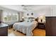 This bedroom has a window view, a ceiling fan, and two bedside lamps at 250 Santa Maria St # 314, Venice, FL 34285