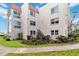 Exterior of the building has manicured landscaping and sidewalks at 250 Santa Maria St # 314, Venice, FL 34285