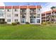 Exterior showcases a manicured lawn and balconies on each unit at 250 Santa Maria St # 314, Venice, FL 34285