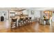 Open kitchen and dining area with hardwood floors and seating at the kitchen counter at 250 Santa Maria St # 314, Venice, FL 34285