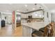 Bright kitchen with white cabinets, stainless appliances and tan granite countertops at 250 Santa Maria St # 314, Venice, FL 34285