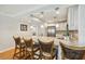 Bright kitchen with white cabinets, stainless appliances and tan granite countertops at 250 Santa Maria St # 314, Venice, FL 34285