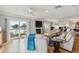 A bright living room with hardwood floors, waterfront balcony, and a fireplace, creating a serene atmosphere at 250 Santa Maria St # 314, Venice, FL 34285