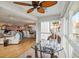 Spacious living area with dining area, fireplace, and glass enclosed sitting area at 250 Santa Maria St # 314, Venice, FL 34285
