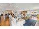 A bright living room with hardwood floors, a kitchen view, and stylish furnishings, ideal for entertaining at 250 Santa Maria St # 314, Venice, FL 34285