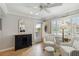 Cozy sitting room with tiled floor, shuttered windows, and a built-in wine rack at 250 Santa Maria St # 314, Venice, FL 34285