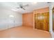 Spacious bedroom with bi-fold closet, and a ceiling fan for comfort at 2555 Yucca Rd, Venice, FL 34293