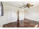 Neutral bedroom includes closet, ceiling fan, and shining floor at 2555 Yucca Rd, Venice, FL 34293