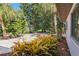 The landscaped yard features gravel and colorful plants, offering a low-maintenance yet vibrant outdoor space at 2555 Yucca Rd, Venice, FL 34293
