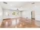 A spacious living room with polished floors and natural light, creating a bright and welcoming atmosphere at 2555 Yucca Rd, Venice, FL 34293