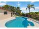 Backyard pool with palm tree, ideal for cooling off and enjoying sunny days at 2555 Yucca Rd, Venice, FL 34293