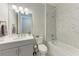 Bathroom featuring a shower and tub, vanity, mirror, and toilet at 257 Teramo Way, Nokomis, FL 34275