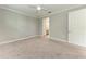 Bright bedroom with neutral walls and plush carpet features a ceiling fan for added comfort at 257 Teramo Way, Nokomis, FL 34275