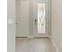 Entry foyer features wood look floors and neutral colors at 257 Teramo Way, Nokomis, FL 34275