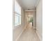 Hallway with wood look floors and neutral colors at 257 Teramo Way, Nokomis, FL 34275