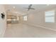 Open-concept living area with light tile flooring, recessed lighting, and a modern aesthetic at 257 Teramo Way, Nokomis, FL 34275