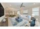 Bright living room featuring contemporary décor, an open floorplan, and stylish furnishings at 257 Teramo Way, Nokomis, FL 34275
