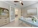 Bright home office features wood floors, ceiling fan, and glass doors leading to another room at 257 Teramo Way, Nokomis, FL 34275
