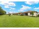 Expansive backyard featuring lush green grass and well-maintained landscaping with screened in patios at 260 Soliera St, Nokomis, FL 34275