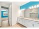 Bright bathroom boasts a double sink vanity, and a beautifully tiled walk-in shower at 260 Soliera St, Nokomis, FL 34275