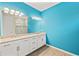 Bathroom with double sink vanity and a beautifully tiled walk-in shower at 260 Soliera St, Nokomis, FL 34275
