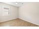 Neutral bedroom features a window for natural light and tile flooring at 260 Soliera St, Nokomis, FL 34275