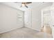 Bedroom with carpeted floors, a ceiling fan, and a closet at 260 Soliera St, Nokomis, FL 34275