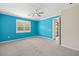 Spacious bedroom with a large window and ceiling fan providing comfort and natural light at 260 Soliera St, Nokomis, FL 34275